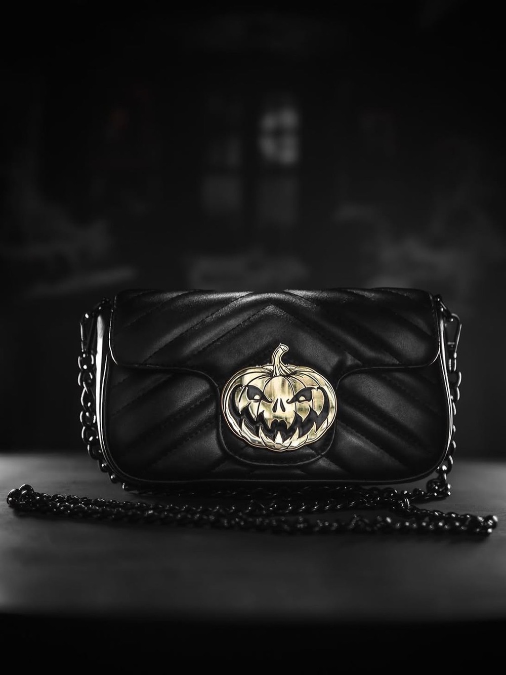 Halloween pumpkin goth fancyBlack Quilted Crossbody Bag with Gold Pumpkin Emblem